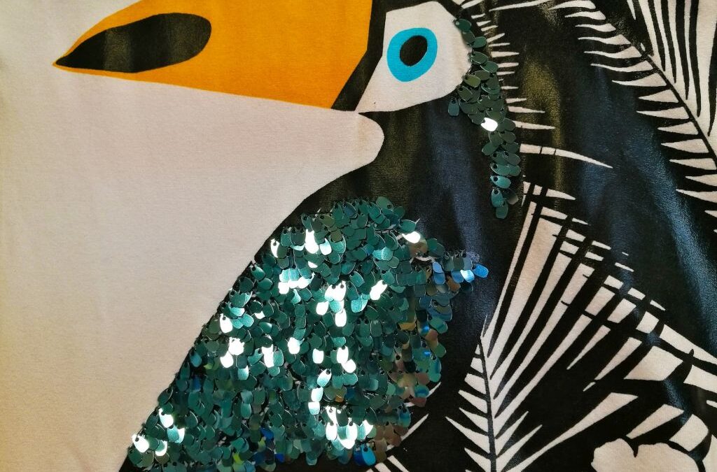 Bordado  de lentejuelas sobre estampado